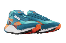 Load image into Gallery viewer, A pair of women's Reebok Classic Legacy sneakers with blue, orange, white, and black colors featuring a chunky midsole and a durable rubber outsole.