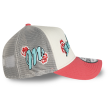 Load image into Gallery viewer, A trucker-style baseball cap with a cream front panel, gray mesh back, and coral-pink brim. The front features embroidered teal and red script lettering with red floral accents, and a silver New Era 9FORTY sticker is visible on the brim.