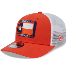 Load image into Gallery viewer, An orange and white New Era 9Seventy snapback trucker cap with a curved bill, featuring Houston Astros branding.