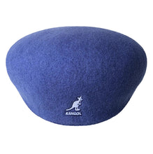Load image into Gallery viewer, A blue felt beret hat with a small white embroidered Kangol logo on the front.