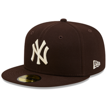 Load image into Gallery viewer, A dark brown New York Yankees fitted cap by New Era, featuring a cream-colored embroidered NY logo on the front and a white New Era flag logo on the side.