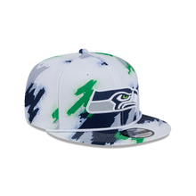 Load image into Gallery viewer, Seattle Seahawks New Era 9Fifty 950 Paint Splatter Snapback Hat