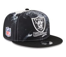 Load image into Gallery viewer, A black and silver tie-dye snapback hat with the Las Vegas Raiders logo and NFL branding on it.